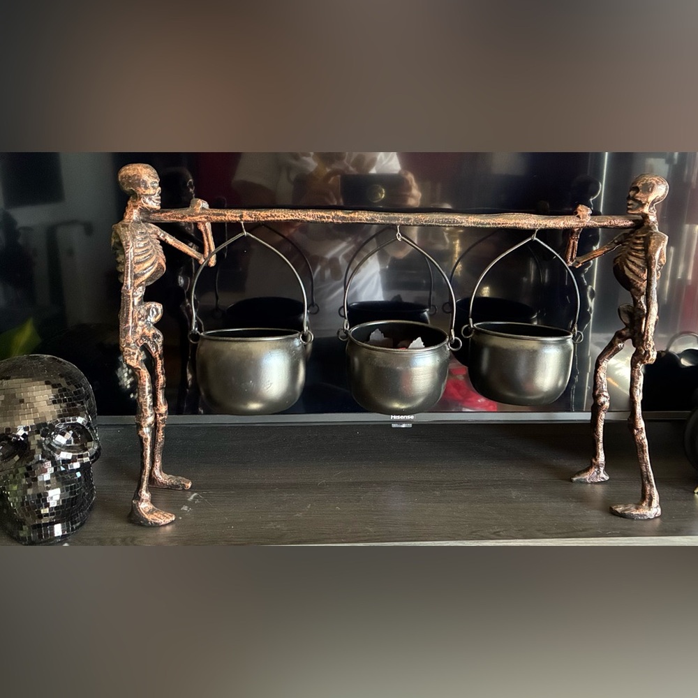Skeletons Holding Black Hanging Cauldron Set